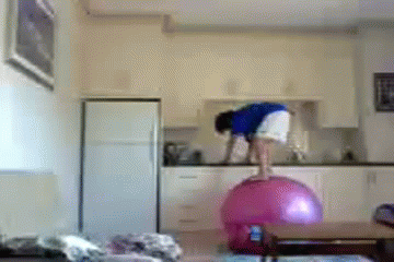 funny-woman-exercise-ball-fall-hit-wall-